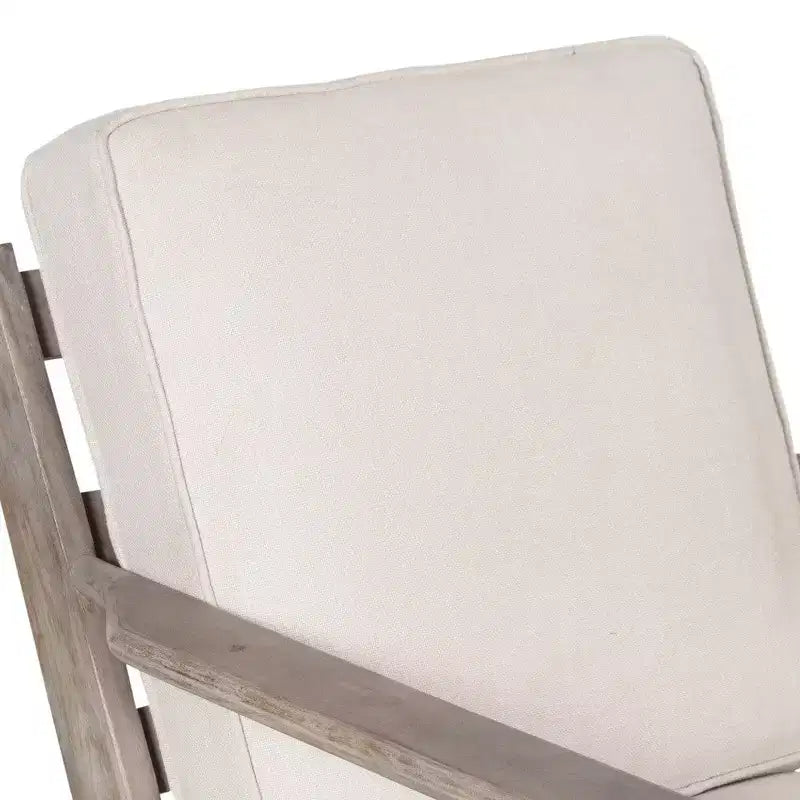Poltroncina artigianale in legno di mango con sedile imbottito e gambe oblique
