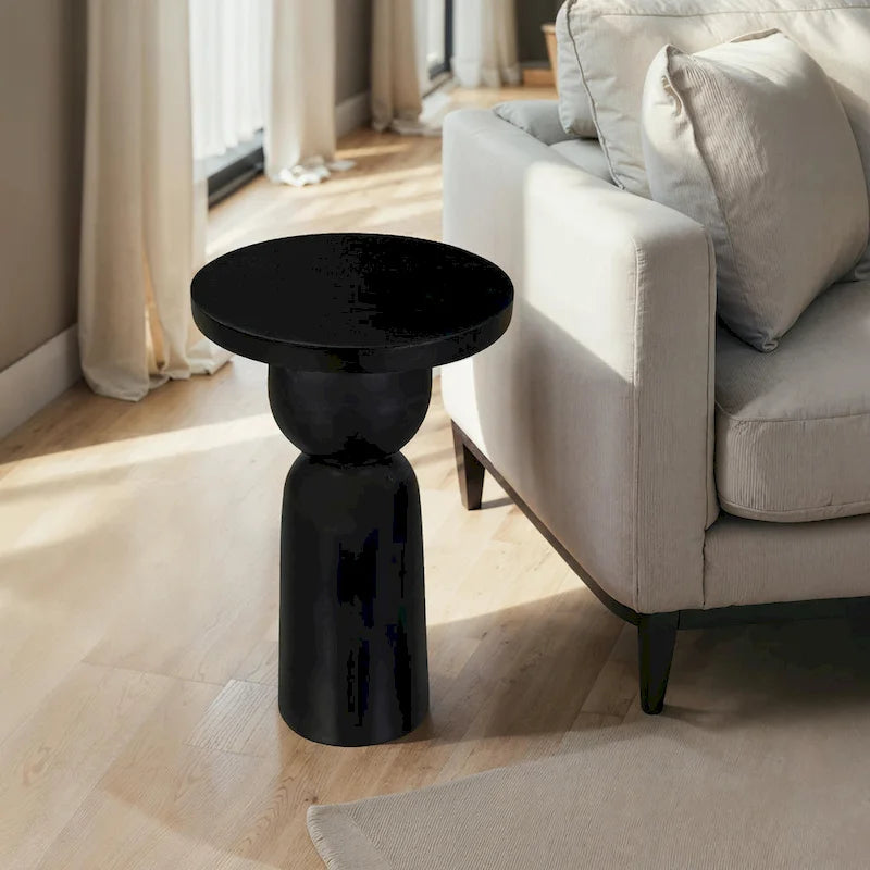 Tavolino rotondo Tia da 30 cm con base a piedistallo tornito, in legno di mango con finitura nero opaco