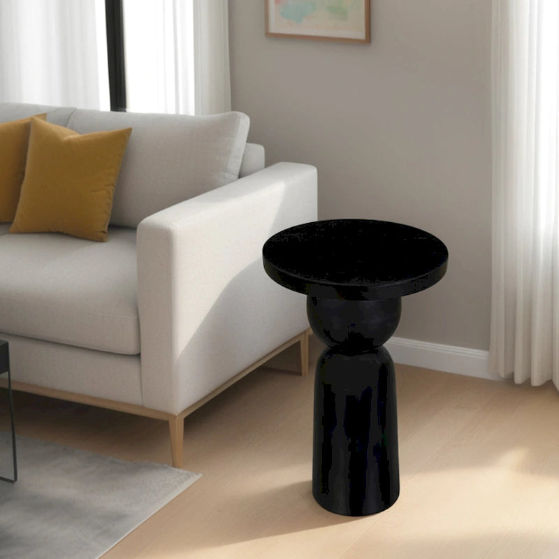 Tavolino rotondo Tia da 30 cm con base a piedistallo tornito, in legno di mango con finitura nero opaco