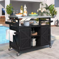 Isola per cucina Okak Outdoor con piano in acciaio inossidabile, carrello da cucina in legno con ante, ripiani e porta spezie, isola da cucina con ruote
