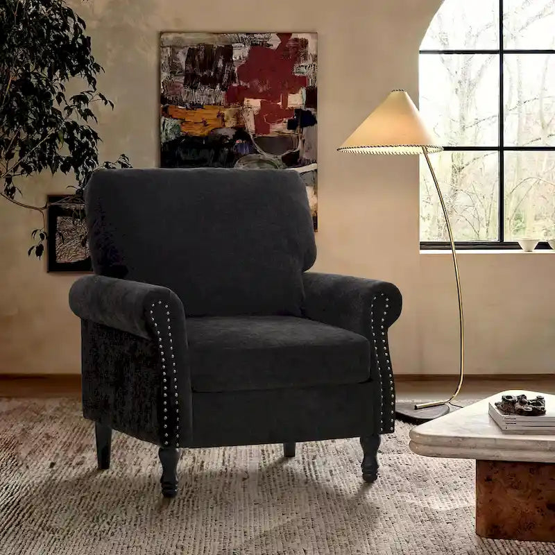 Poltrona moderna imbottita con borchie e gambe in legno